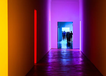 Rear view of man walking in room