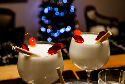 Close-up of wine glasses on table