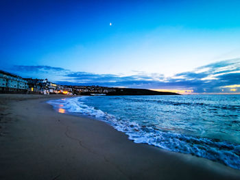 Scenic view of sea against sky at night