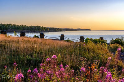 Scenic view of lake superior against sky at sunrise 