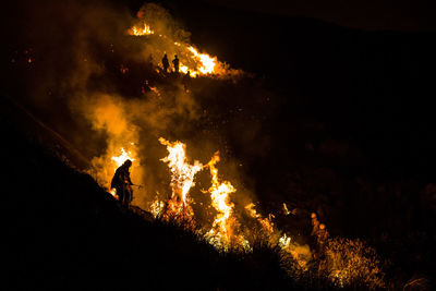 Firefighters working at night