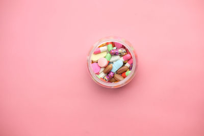 High angle view of multi colored candies in container