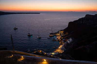 View of sailboat in sea during dusk