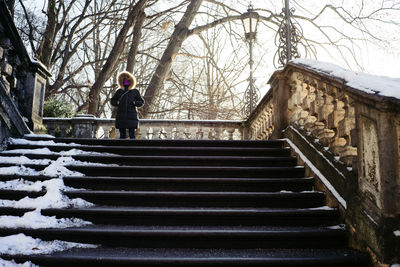 Low angle view of man walking on stairs