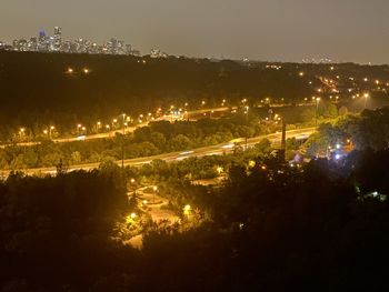 High angle view of illuminated city buildings at night