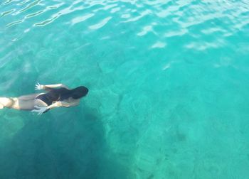 High angle view of woman swimming in pool