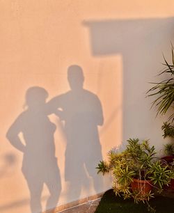 Shadow of people on wall