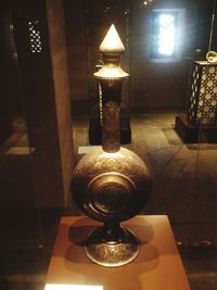 Close-up of illuminated lamp on table at home