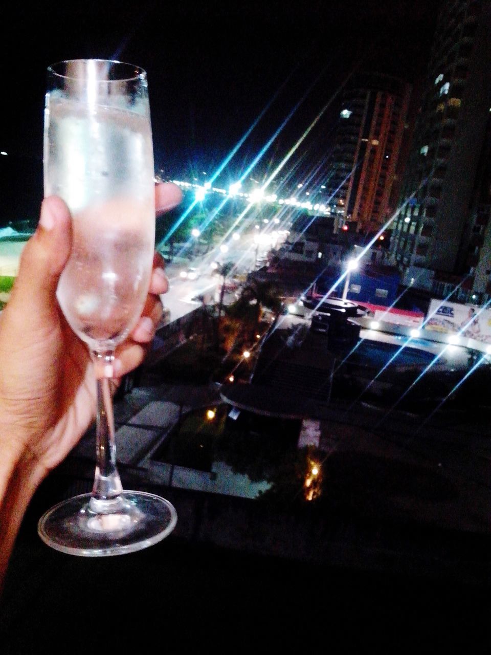 person, illuminated, indoors, night, food and drink, part of, drinking glass, holding, close-up, wineglass, cropped, human finger, drink, alcohol, table, glowing, candle