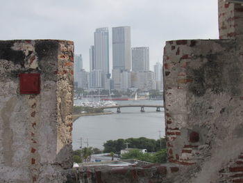 Buildings in city against sky