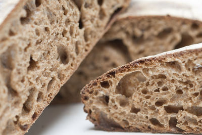 Sliced sourdough bread on white background