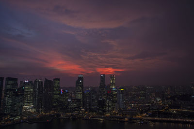 Aerial view of city lit up at night