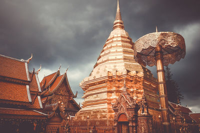 Low angle view of temple building against cloudy sky