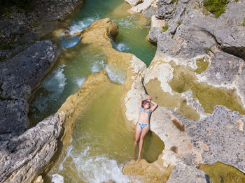 High angle view of people on rock