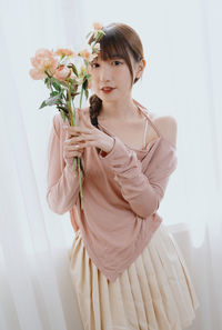 Young woman with bouquet