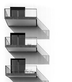 Low angle view of building balconies during sunny day