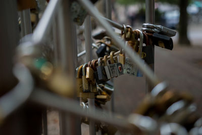 Close-up of padlocks on railing