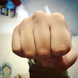 Close-up of clenching fist