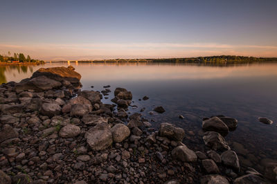 Scenic view of lake at sunset