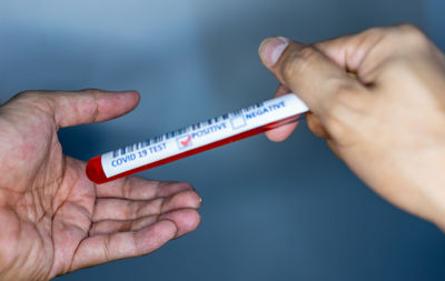 Close-up of person holding hands