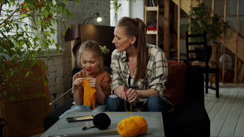 Portrait of young woman working at home