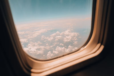 Aerial view of landscape seen through airplane window