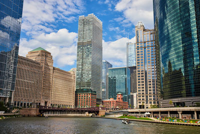 Modern buildings in city against sky