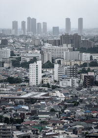 High angle view of buildings against sky in city