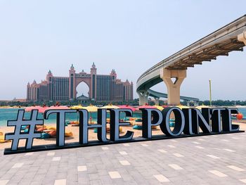 View of bridge in city against clear sky