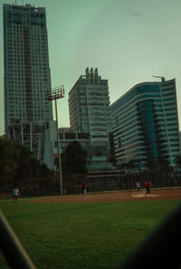 Buildings in city against sky