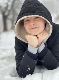 Portrait of smiling girl wearing hat during winter