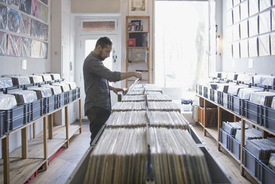 Young man shopping for records