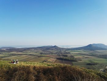 Scenic view of landscape against clear blue sky