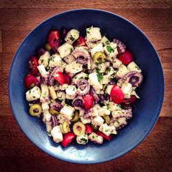 Close-up overhead view of octopus salad in bowl