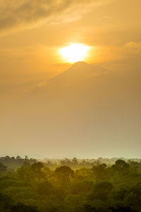 Scenic view of landscape against sky during sunset