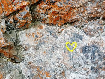 Close-up of text on rock