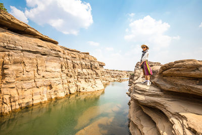 Panoramic view of sculpture and rock formations against sky