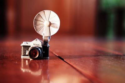 Close-up of camera on table