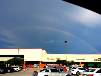 Rainbow over city street