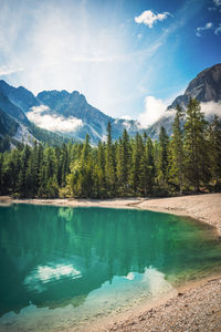 Scenic view of lake and mountains against sky