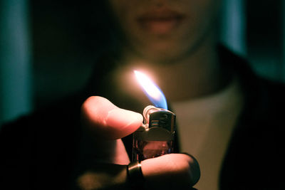 The man holding burning candle