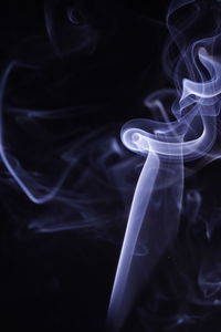 Close-up of light painting against black background