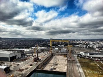 High angle view of city against cloudy sky