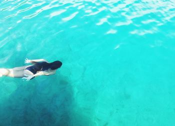 High angle view of man swimming in sea