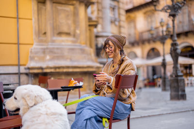 Portrait of young woman using mobile phone