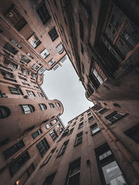 Low angle view of buildings in city against sky