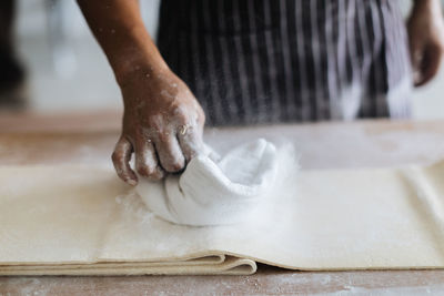 Close-up of person preparing food