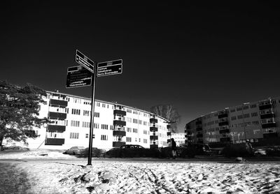 Road sign against clear sky