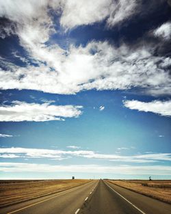 Empty road against sky