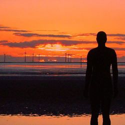 Silhouette of people at sunset